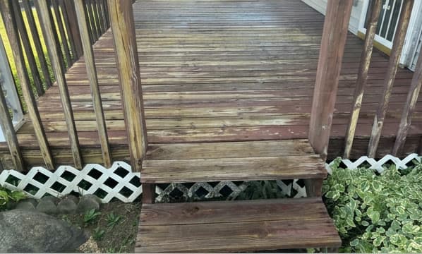 Weathered deck, cleaned and restained — before