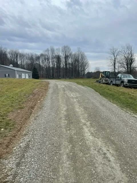 Gravel drive cut, graded, and finished